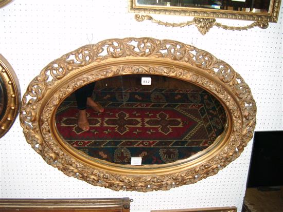 19th century giltwood and composite oval wall mirror(-)